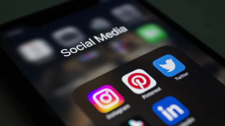 Smartphone with social media apps illustrating Meta Ads and social media advertising in Dubai