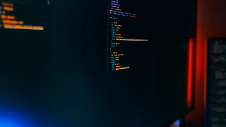 Dark technical workspace illustrating code, website performance and technical SEO auditing in Dubai